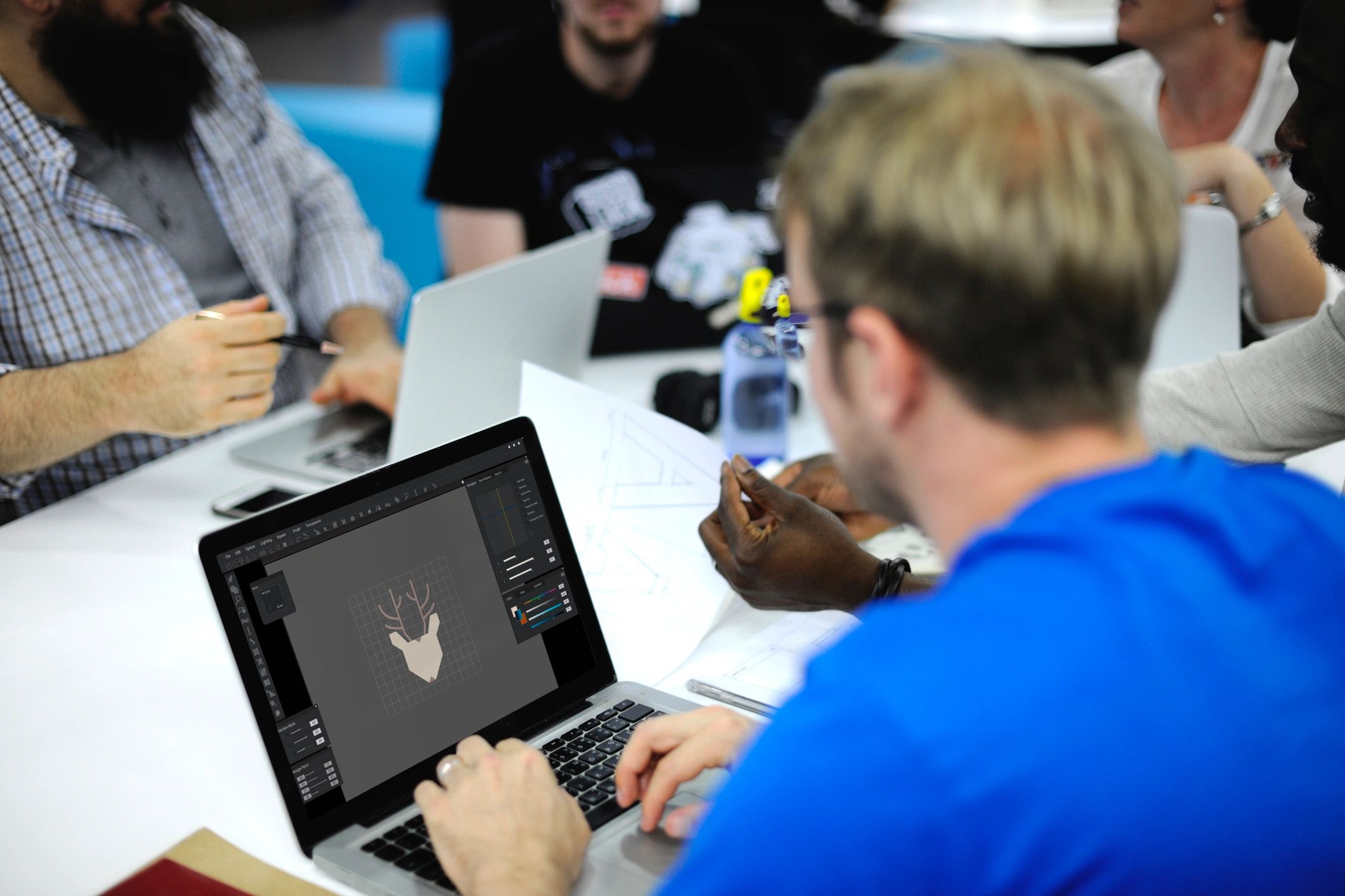 Consultants reviewing project information on a laptop