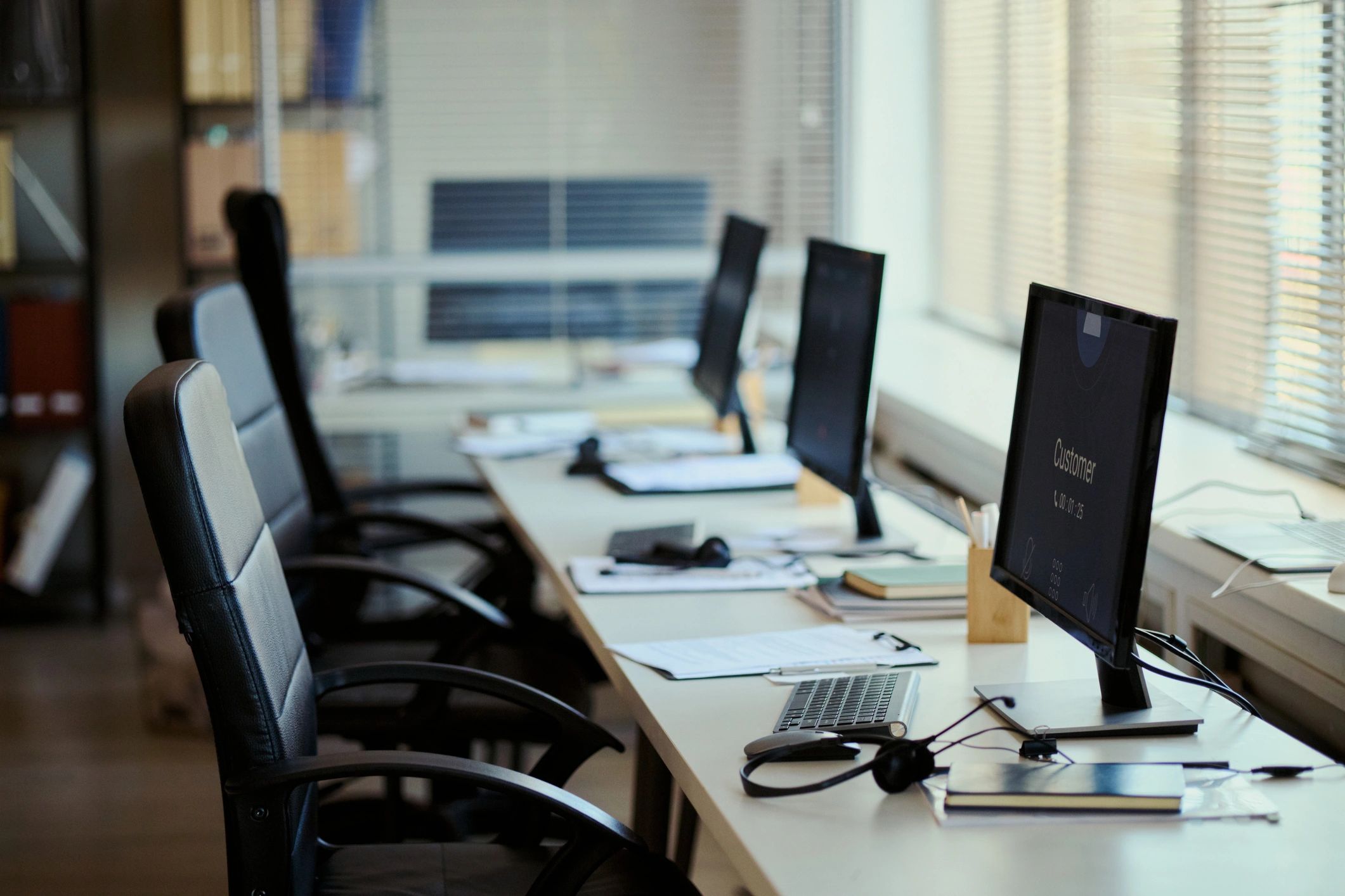 Call center workstations in a modern office representing business communications and support